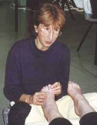 Helen Perkins vocalizing with intuition and sound reflexology during a treatment