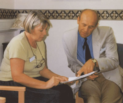 Nicky Baker & Hospital Chaplain Gordon Kendall discussing a spirituality workshop.