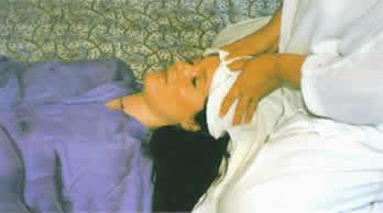 A Shiatsu practitioner may use a cloth when working on the face or head.