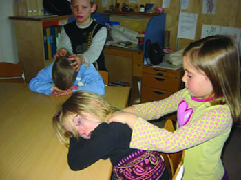 Children performing massage