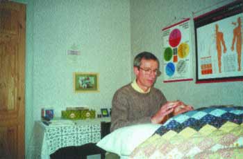 The author giving a Reiki healing treatment