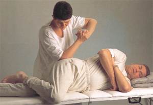TUI NA Pressing and Kneading Qi-points: Your partner lies on his left side with a small pillow supporting his head. The left leg is straight. Bend his right leg and draw it up in front so the thigh is at right angles to the body. Standing behind your partner and leaning over the right hip, or sitting beside his abdomen, elbow knead GB 30 for at least two minutes with small, circular movements. Start lightly and gradually put more bodyweight behind it. Then squeeze with the whole hand, and knead with the whole of the hand, down the bent leg. Press and knead GB 31. Deep kneading of GB 30 can be uncomfortable but strongly relieves sciatica, however severe. From Step by Step Tui Na by Maria Mercati.Gai Books 1997.