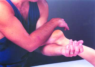 The author providing No-Hands Massage and receiving massage to his own forearms