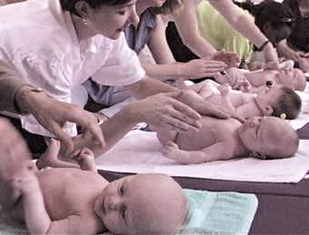 An NHS postnatal class taught by the author. Enjoyment by mothers and their babies is evident