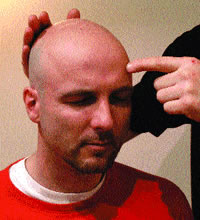 Manipulation Technique Ã¢â‚¬â€œ Author treating a client using the finger to manipulate blocked points on the clientÃ¢â‚¬â„¢s cranium