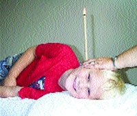 A Hopi Ear Candle in use