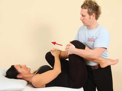 From the flexed position, the patient is asked to resist hip flexion.