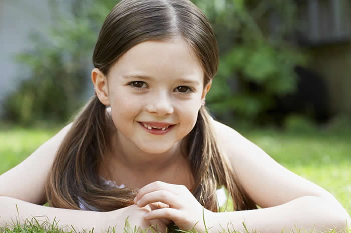 Little Girl Lying in Grass