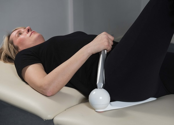 Person using Pelvipro to relieve lower back pain
