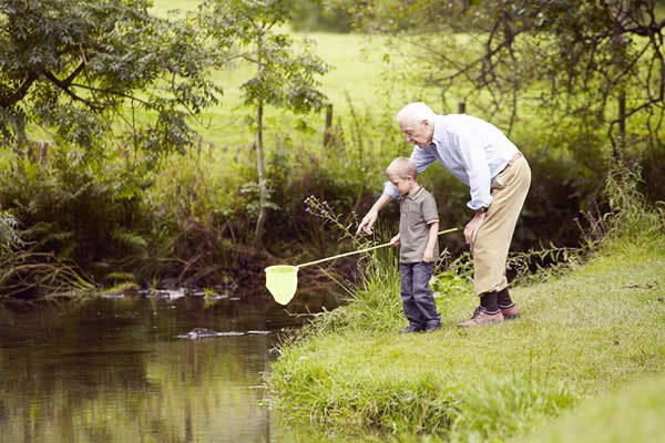 Great-Grandparent fishing with grandchild