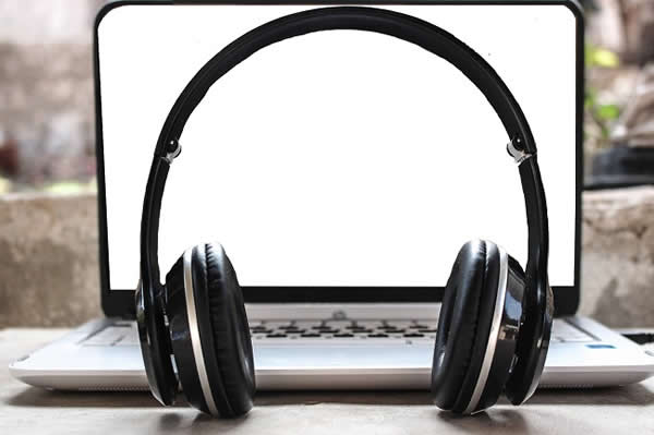 headphones in front of laptop