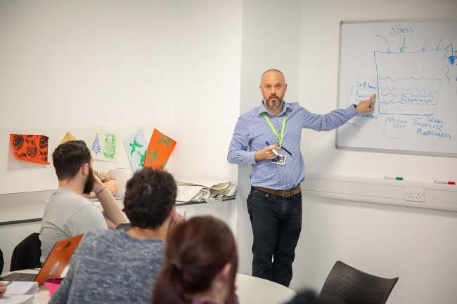 Vice Chancellor Sir David Bell in Occupational Therapy Session