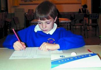 Christopher concentrating on his maths at the local Kumon Maths Centre