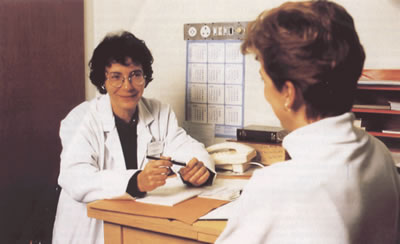 A nurse advising a patient on complementary therapies.