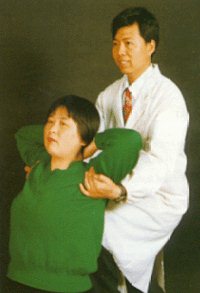 Here the patient is receiving an upper back manipulation