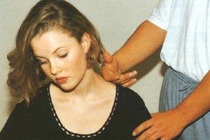 The rolling technique being applied along the trapezius muscle.