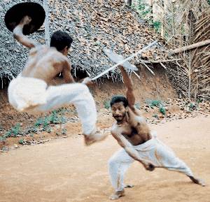 Northern Kalari Sword and Shield fighting form, showing one of the spectacular leaps for which Northern Style is famous