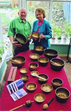 The authors with a diverse selection of Tibetan bowls