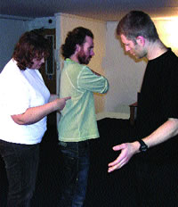 Michael and students Ã¢â‚¬â€œ Michael scanning the work of students working on each other during a training workshop