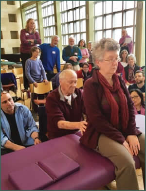 Dr Smith demonstrating seated evaluation of the sacra-iliac joint at ZB & Consciousness, Newton, Massachusetts, 2016