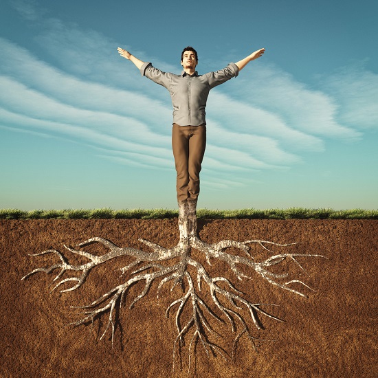 Image of a man that has taken root in the ground.